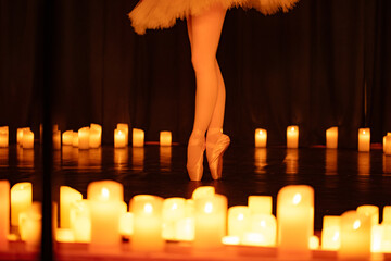balerina dancing on stage with lots of candles © Ruslan