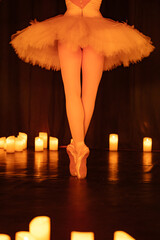 balerina dancing on stage with lots of candles © Ruslan