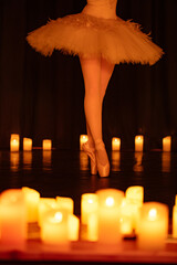 balerina dancing on stage with lots of candles © Ruslan