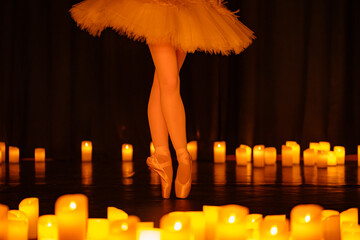 balerina dancing on stage with lots of candles © Ruslan