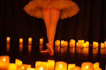balerina dancing on stage with lots of candles © Ruslan