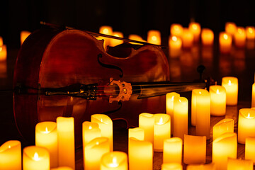closeup of violin with lots of candles