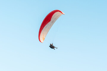 Paragliders in the sky. Man paragliding in a blue sky, on Cerro el Morro from Lechería, Venezuela