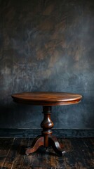 Vintage wooden round table against dark textured wall