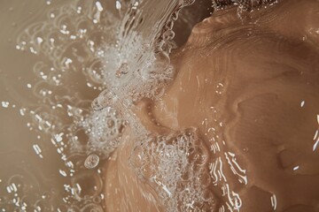 Fototapeta premium Close Up of Water Splashing in a Brown Bathtub