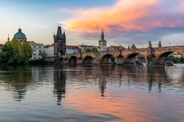 Colorful sunrise over Charles Bridge (Karluv Most) over Vltava River in Prague, Czech Republic