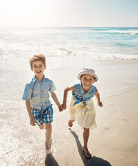 Beach, smile and portrait of children holding hands on holiday, vacation and tropical adventure. Happy family, summer and young boy and girl by ocean for bonding, playing in waves and fun outdoors