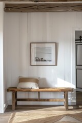 A wooden bench in a cozy room with a picture frame on the wall, providing a comfortable seating area