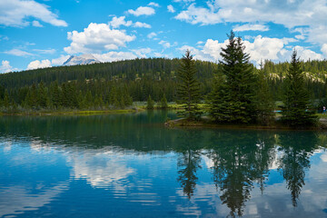Incredible majestic mountains against the background of the beautiful turquoise Lake Minewanka in Banff National Park in Canada