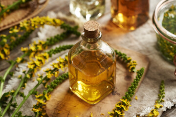 Herbal tincture with fresh blooming agrimony plant