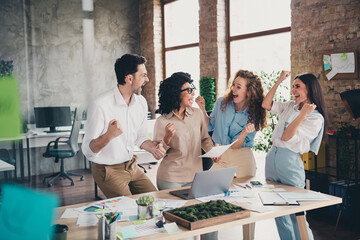Photo of group business company workers netbook document raise fists modern loft interior office indoors