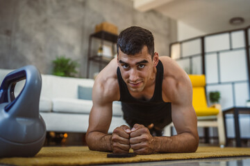 Young man have plank exercise in the living room