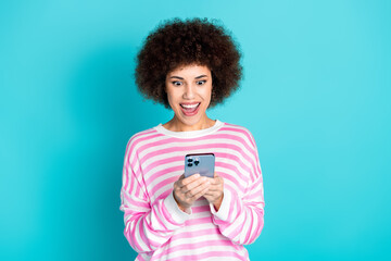 Photo of excited positive woman wear striped sweater online shopping modern device empty space isolated teal color background