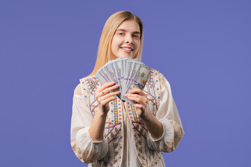 Fototapeta premium Rich Young Woman With Money. Smiling Luck Girl Praised Usd Dollars Banknotes