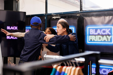 Black Friday crowd control. Anxious frenzied people shoppers near the store entrance during seasonal sales, waiting to start shopping in clothing store and get best deals first