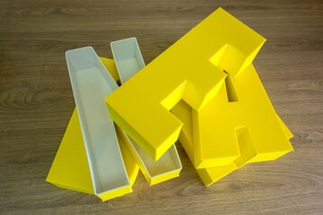 Three-dimensional light letters made of PVC plastic covered with yellow film.Production of outdoor...