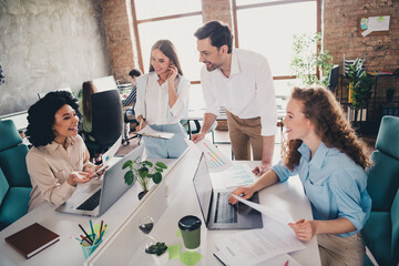 Photo of brainstorm workstation teamwork startup partners young people work together conference meeting nice comfortable light office