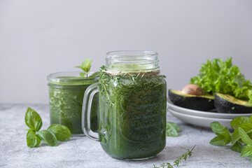 Blended green smoothie with ingredients. Healthy smoothie