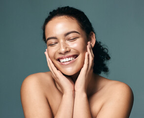 Eyes closed, beauty and woman with skincare, cosmetics and dermatology on grey studio background....