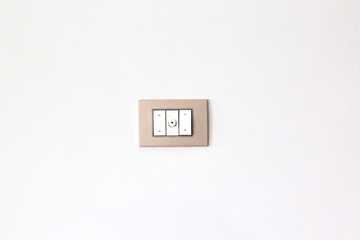 European style wall light switch on a white background. Three sections and dimmer control. Space for copying