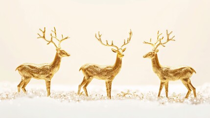 Obraz premium Golden deer figurines in snowy landscape Concept of holiday decor festive ornament winter decoration
