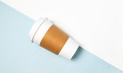 Mockup Paper Drinks Mug, Cup with White Lid and Corrugated Sleeve On White and Blue Background. Eco Hot Beverage Tumbler, Horizontal Plane, Copy Space. On the Go Food Service Application