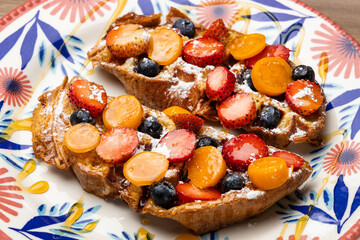 French toast, the breakfast or snack recipe - Strawberries, blueberries and cape gooseberry