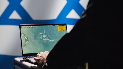 Iranian spy in control room uses military tech to identify threats during Arab Israeli conflict....