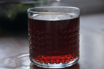 hot americano in glass cup on black background