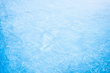 Detailed view electric blue ice surface with rippling pattern caused by wind waves, creating mesmerizing fluid texture