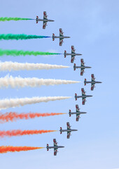 The Frecce Tricolori, Italy's celebrated aerobatic team flying on the blue sky background