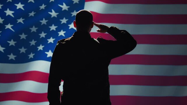 American soldier doing saluting hand gesture towards USA flag in command center, showing respect. Military unit in uniform serving in United States Armed Forces, doing patriotic gesturing, camera B