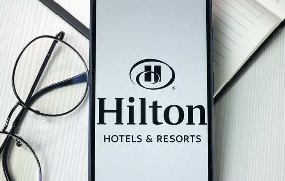 New York, USA - 21 June 2024: Hilton Hotels Logo on Phone Screen, Company Icon