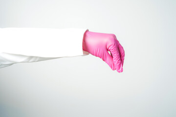 hand gestures or signs in pink disposable latex surgical gloves isolated