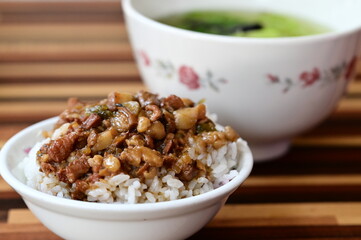 Taiwanese braised pork rice features savory minced pork over fluffy rice, creating a mouthwatering dish renowned for its unique texture and flavor, enhanced with suitable soups and side dishes.