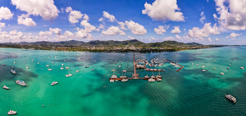 Obraz premium Aerial View Drone shot of Yacht and sailboat parking in marina, Transportation and travel background