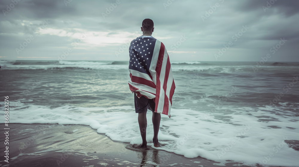 Wall mural patriot on the beach with the american flag independence day