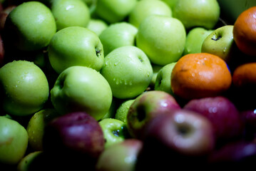 Fresh and tasty mixed apple fruits on the market