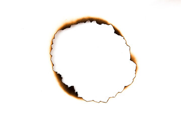 burnt holes in a piece of paper isolated on white background