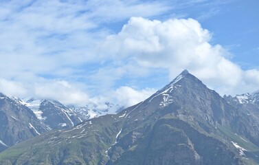 Leh Mountain Peaks Shrouded in Clouds under Clear Blue Sky