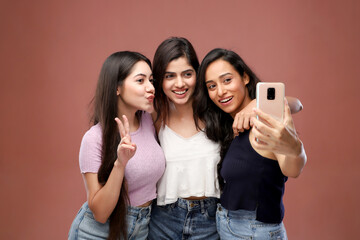 A Team Of Happy Girls Are Making Victory Hand Sign While Clicking Pic