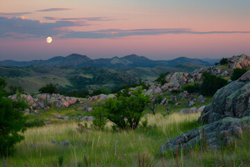 Beautiful scenery of the breathtaking sunset at Montesinho Natural Park in Portugal,
Sunrise at canyon with river, hills and dramatic sky with reflection

