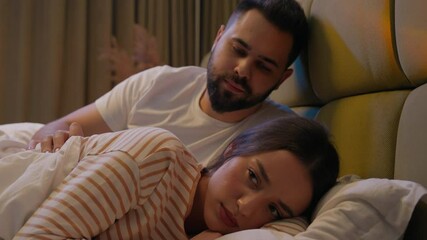 Angry woman after quarrel conflict man reconcile apologize husband wife female male aggressive emotional irritation relationship annoyed regret negative calming support love bed bedroom sorry marriage - Powered by Adobe