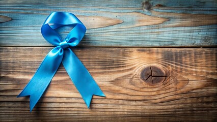 A delicate blue ribbon tied in a poignant bow on a worn wooden background, symbolizing hope and solidarity for social causes and health awareness.