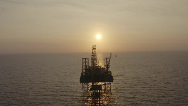 Aerial view of an offshore jack up drilling rig during sunset - oil and gas upstream industry
