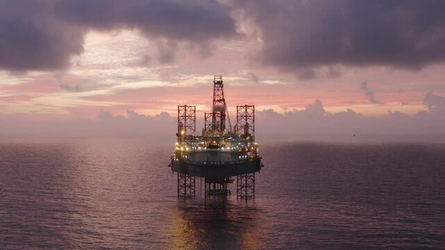 Aerial view of an offshore jack up drilling rig during sunset - oil and gas upstream industry
