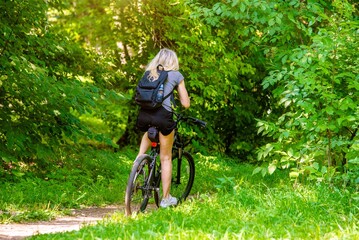 Cyclist ride on the bike path in the city Park
