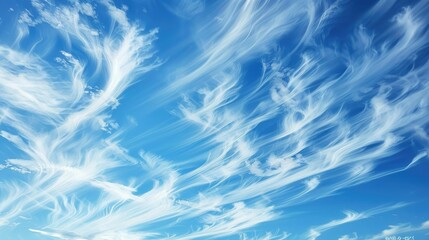 Cirrus clouds drifting across a blue sky in summer nature scene