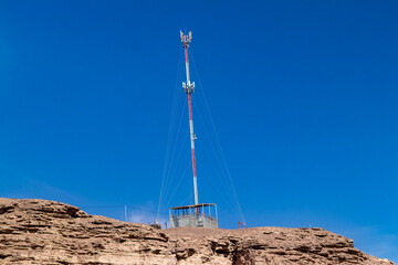 satellite dish in the Atacama desert, with blue background