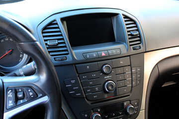 Fototapeta premium Car Touch screen multimedia. Screen multimedia system in a modern car. Car dashboard with multimedia touch screen. Modern car interior.